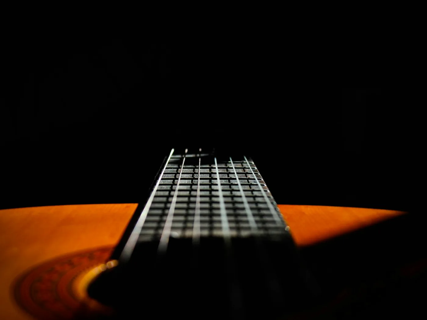 A pear-shaped Portuguese guitar being played